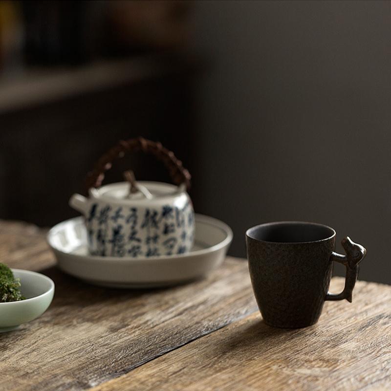 Vintage Black Stoneware Teacup with Dog-shaped Handle-Scene