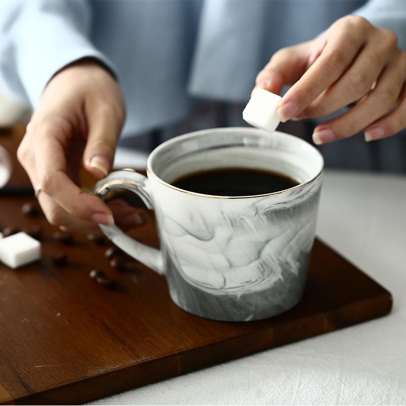 Marble Gray Ceramic Coffee Mug with Handmade Gold Border-Use Scene